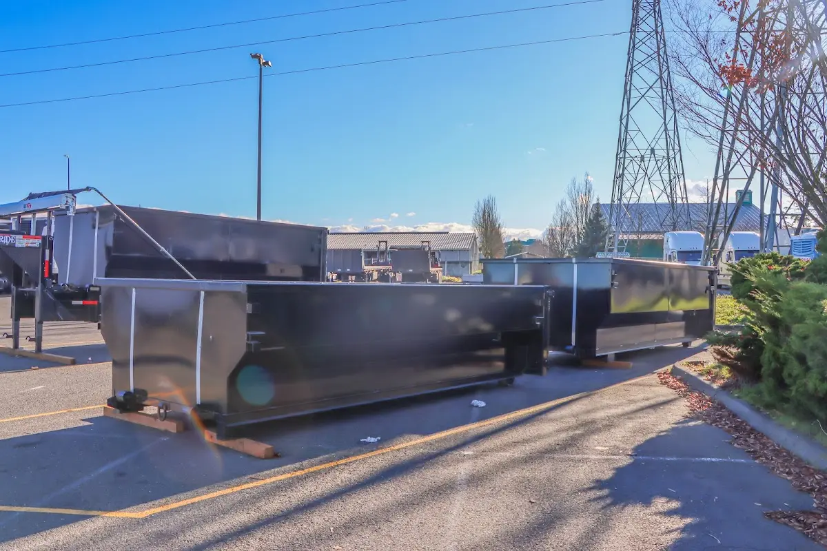 Roll-off dumpster ready for waste disposal at job site for 2 Yard Dumpster Rental in Pilot Point